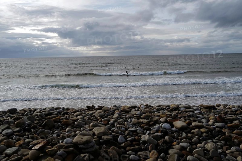 Surfers enjoy the waves along the Wild Atlantic way. Strandhill