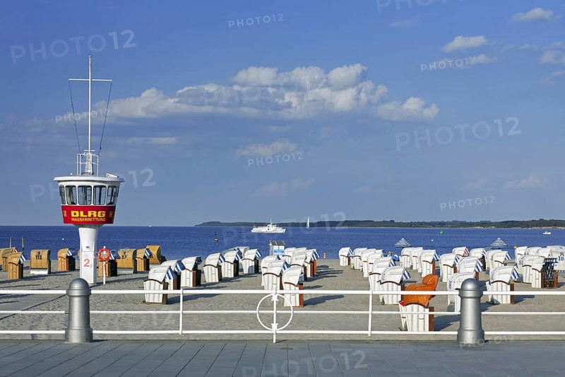 Lifeguard tower and roofed wicker beach chairs on the beach at Travemuende
