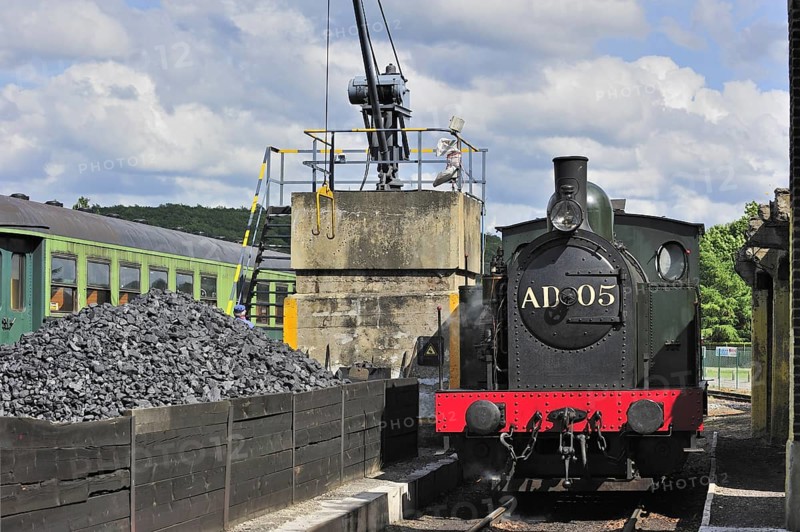 Crane loading coal as fuel for steam train at the depot of the Chemin de Fer a Vapeur des Trois Vallees at Mariembourg