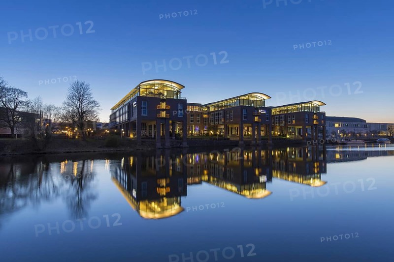 Radisson Blu Senator Hotel along the river Trave at sunset
