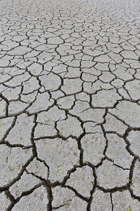 Abstract pattern of dry cracked clay mud in dried up lake bed