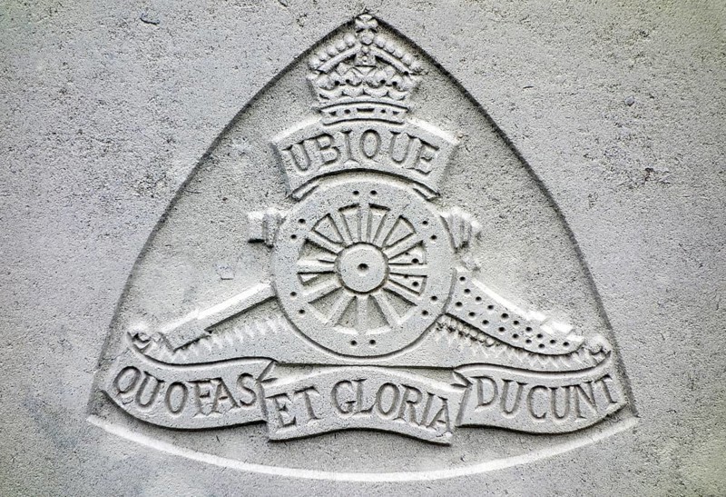 Royal Field Artillery regimental badge on headstone at Cemetery of the Commonwealth War Graves Commission for First World War One British soldiers