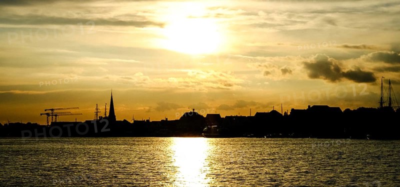 City skyline of Travemuende at sunset. Hanseatic City of Luebeck