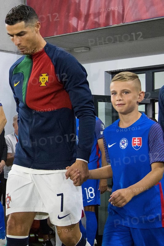 Cristiano RONALDO Portugal with proud Slovakian boy entering the pitch together