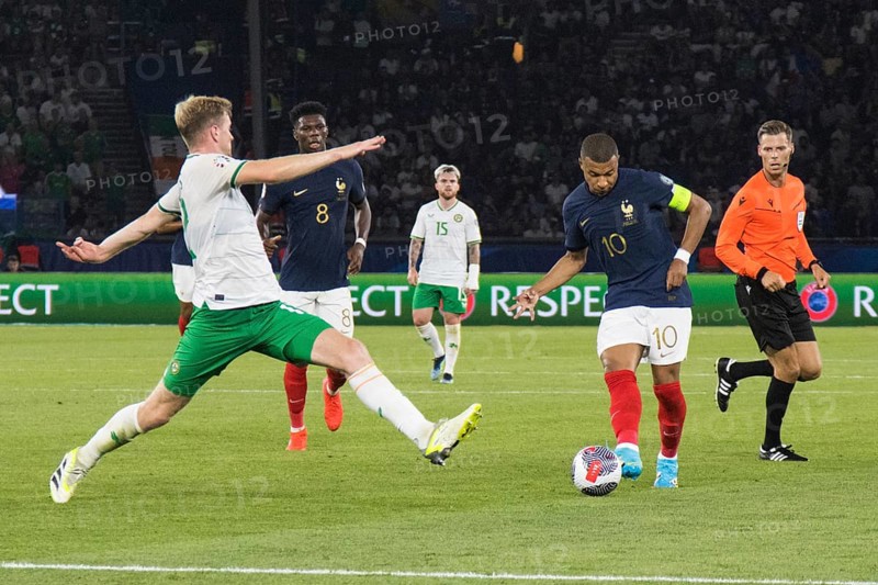 Nathan COLLINS Ireland left tries to stop Kylian MBAPPE France