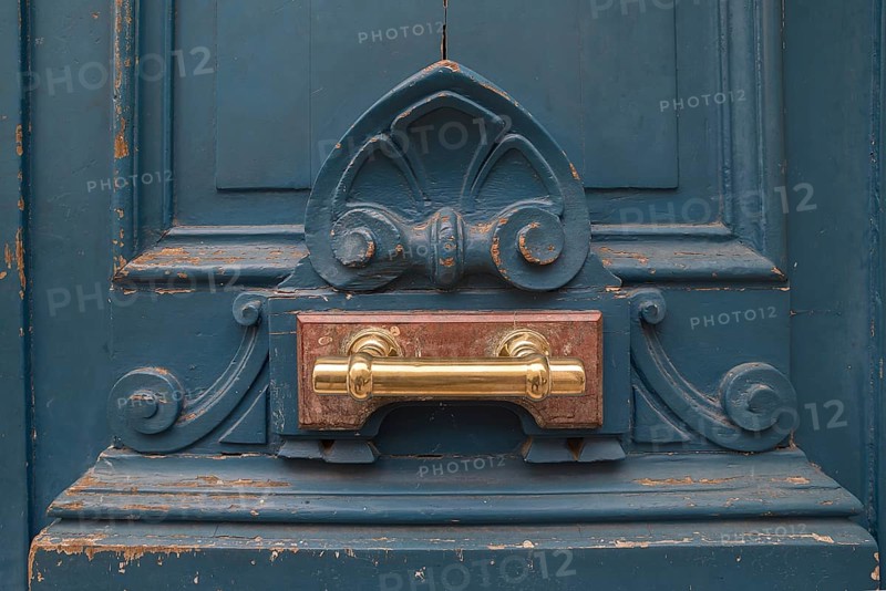 Brass door handle on an old front door