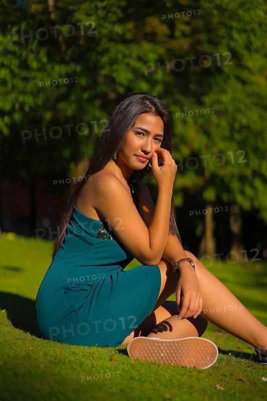 A pretty young brunette Latina with long straight hair