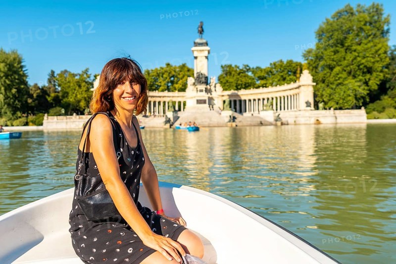 A tourist at the Estanque Grande de El Retiro in the city of Madrid. Spain
