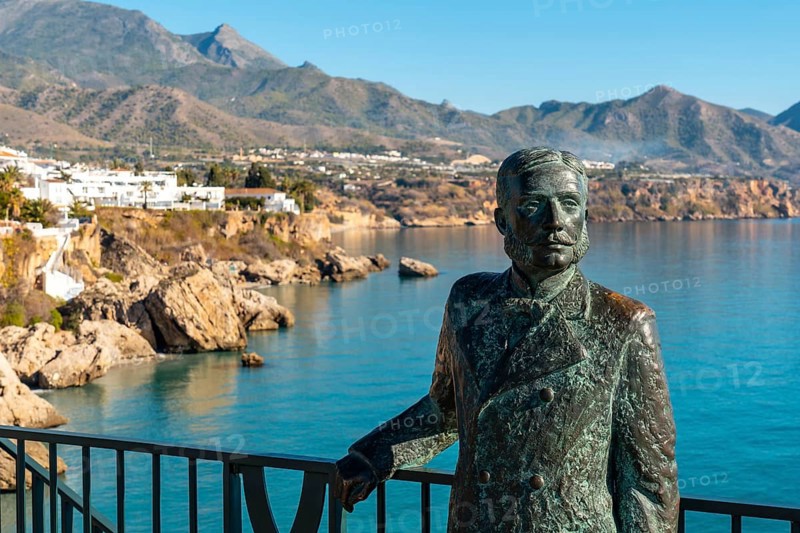 Sculpture on the Balcon de Europa and Calahonda beach in the background of the town of Nerja