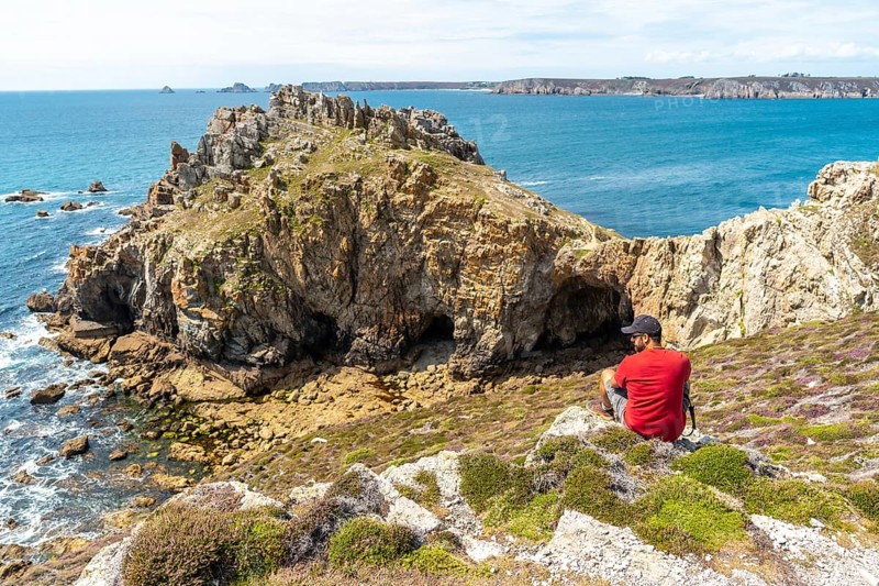 A young man enjoying the summer at Le Chateau de Dinan on the Crozon Peninsula in French Brittany