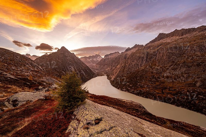 Autumn evening mood at Grimselsee in the Swiss Alps with Zinggenstock