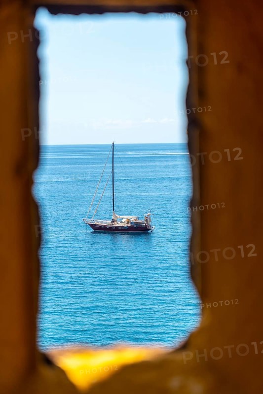 Looking out from the yellow watchtower at the Forte de Sao Tiago fort in Funchal by the sea. Madeira