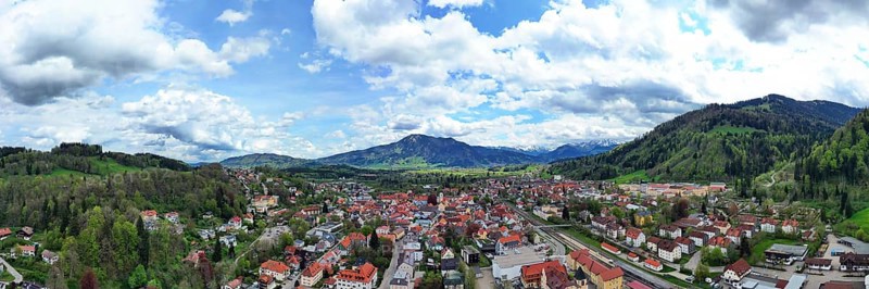 Aerial view of Immenstadt im Allgaeu with a view of the Alps. Immenstadt im Allgaeu