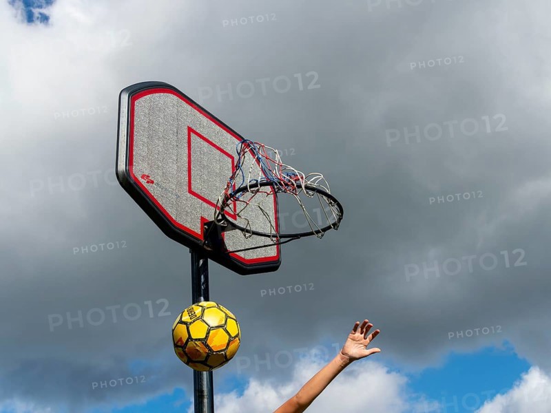 Basketball Jumping with the ball to the basket and net