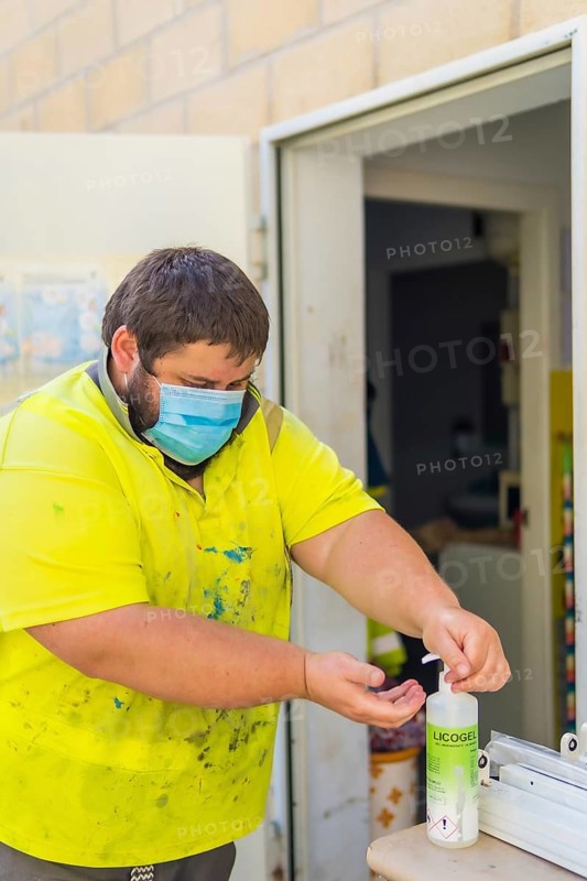 Worker in a recycling factory or clean point and garbage with a face mask and with security protections