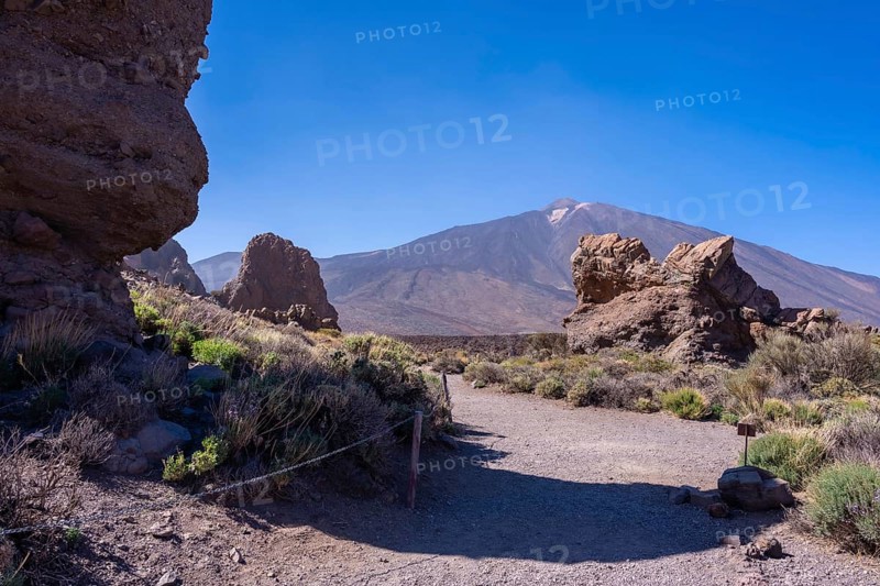 Path to walk between the Roques de Gracia and the Roque Cinchado in the natural area of Mount Teide in Tenerife