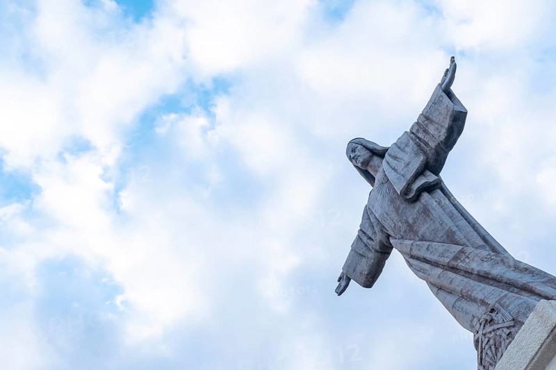 Sculpture detail of Mirador de Cristo Rei in Funchal in summer with clouds