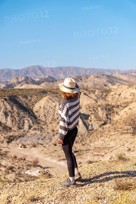A young hiker in the desert canyon of Tabernas