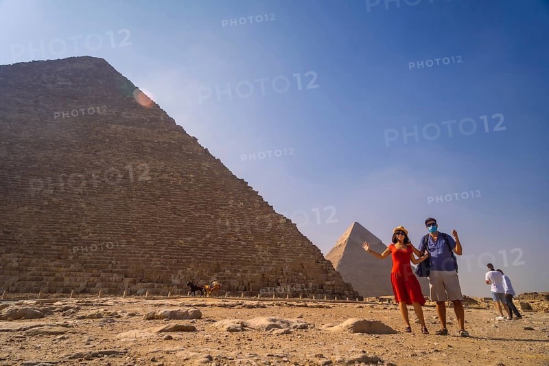 A couple in the pyramid of Cheops the largest pyramid. The pyramids of Giza the oldest funerary monument in the world. In the city of Cairo