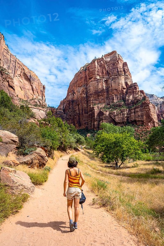 A young woman starting the trekking climb of the Angels Landing Trail in Zion National Park