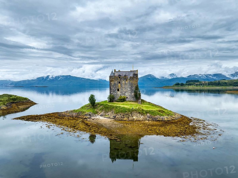 Aerial view of the 14th century island castle Castle Stalker in Loch Laich