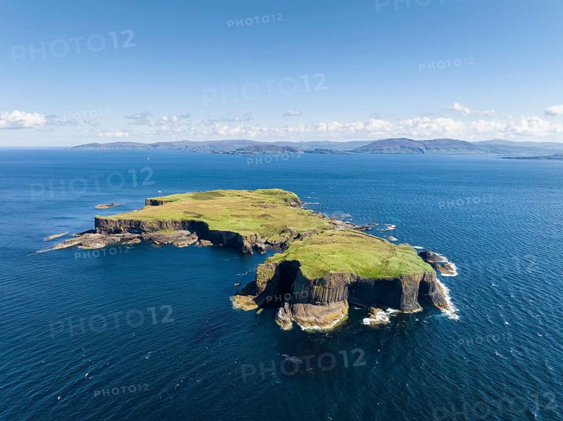 Aerial view of the uninhabited rocky island of Staffa with the prominent basalt columns and Fingal's Cave
