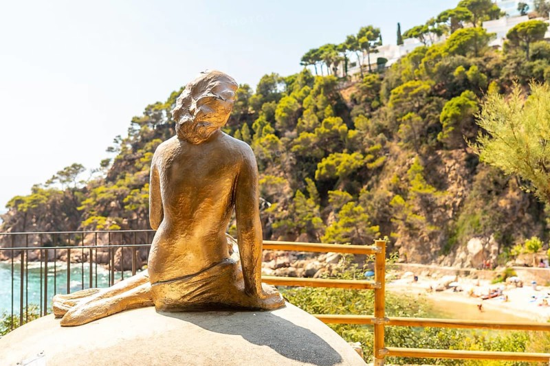 Mermaid sculpture in Cala Canyet next to the town of Tossa de Mar. Girona