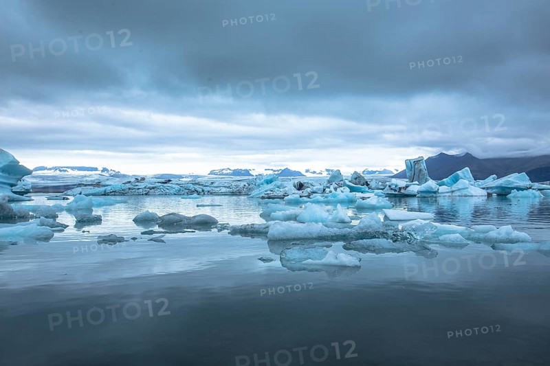 Beautiful icebergs on Jokulsarlon Ice Lake in the golden circle of southern Iceland on a cold August morning
