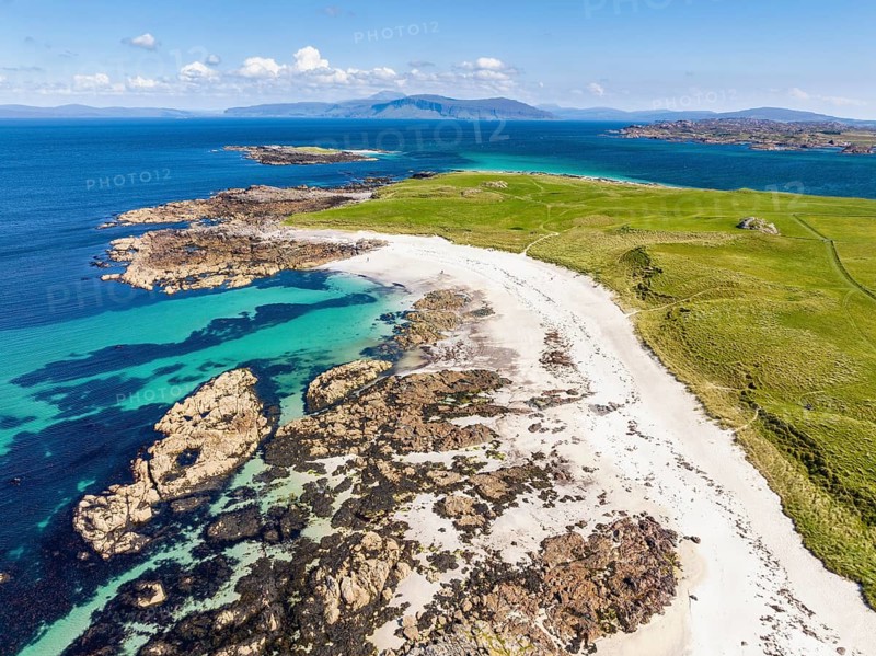 Aerial view of Traigh An T-Suidhe sandy beach on the north side of the Isle of Iona