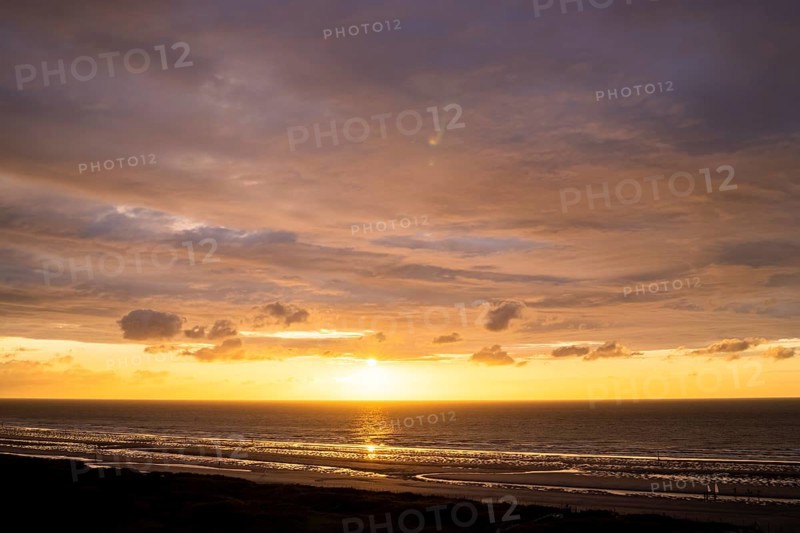 Sunset on the beach of De Panne
