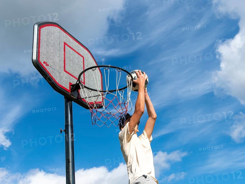 Basketball Jump with the ball to the basket and net