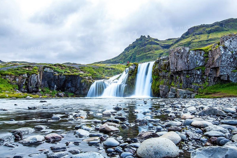 The famous Icelandic mountain Kirkjufell and the small waterfalls