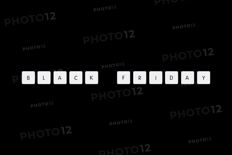 Black friday illustration composition. Text on board game chips. Black textured background