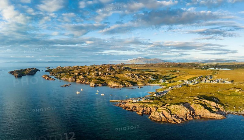 Aerial panorama of the coastline of the Ross of Mull peninsula with the fishing village of Fionnphort