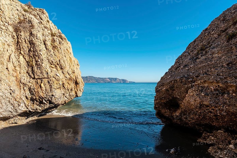 Detail of the sea in the small coves on Calahonda beach in the town of Nerja