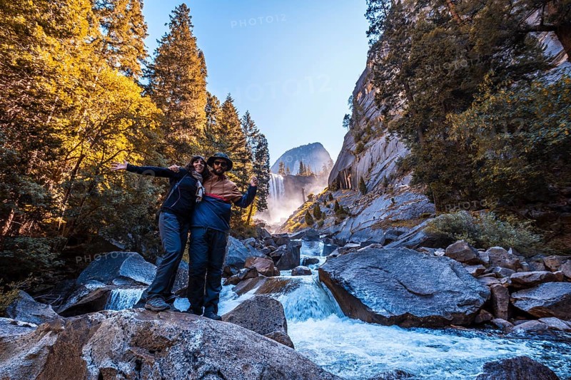 A couple in Vernal Falls waterfall of Yosemite National Park