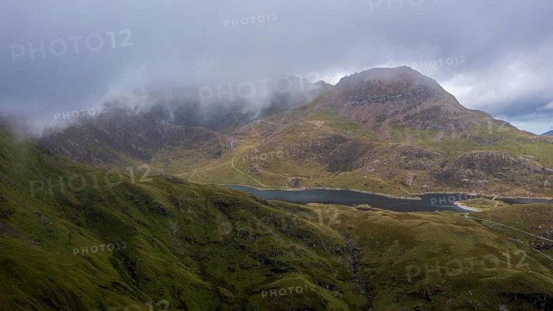 Typical landscape with Snowdon behind clouds in late summer