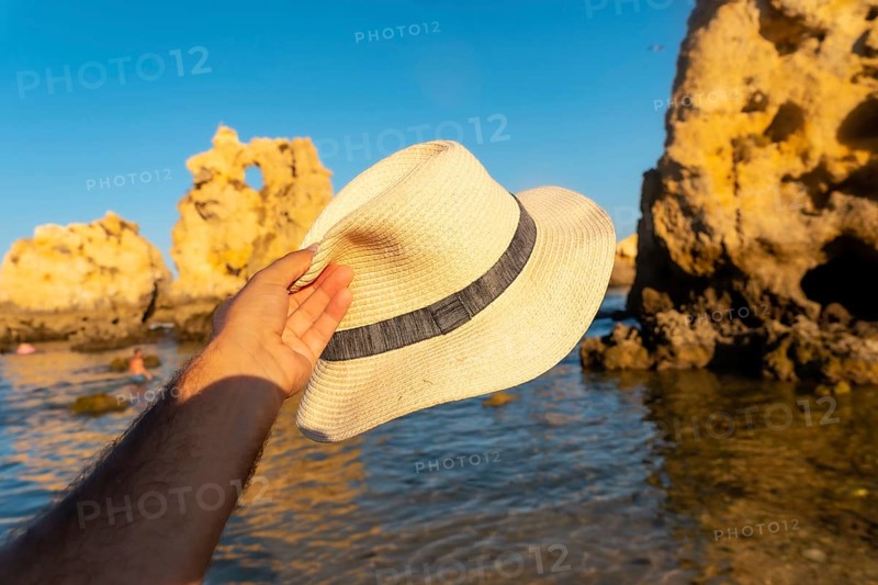 With a hat at Praia dos Arrifes
