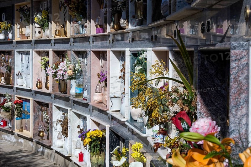 Wall with decorated urns graves in a cemetery in Sardinia