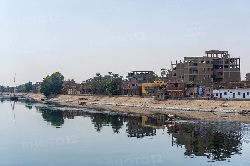 Traditional Egyptian villages on the bank of the river Nile. Views sailing on the cruise on the river Nile from Luxor to Aswer