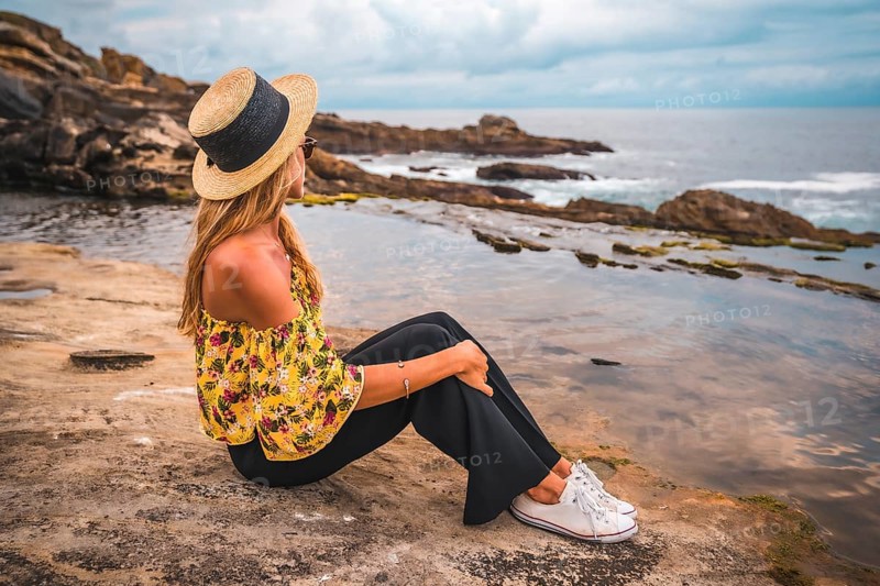 Caucasian blonde girl in a floral shirt