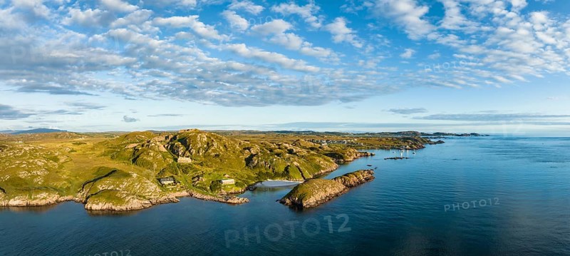Aerial panorama of the coastline of the Ross of Mull peninsula and the fishing village of Fionnphort on the right