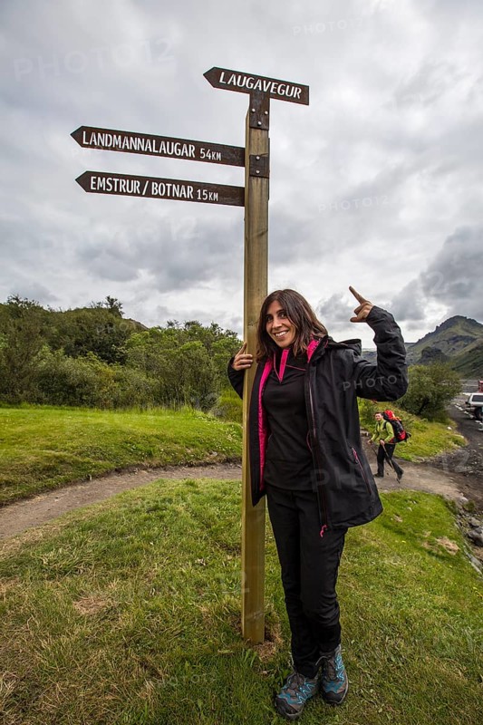 A young woman at the 54 km Thorsmoerk signal of the 4-day trek to Landmannalaugar. Iceland