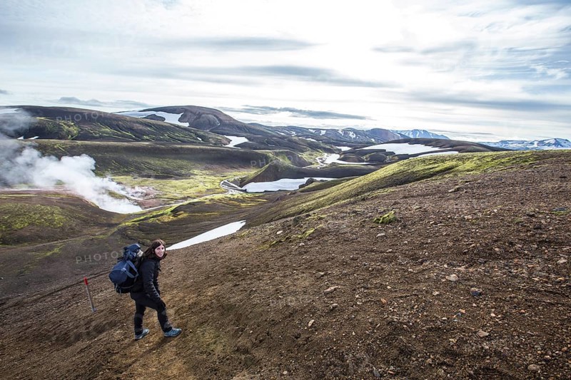 Woman in pools of boiling water on the 54 km trek from Landmannalaugar