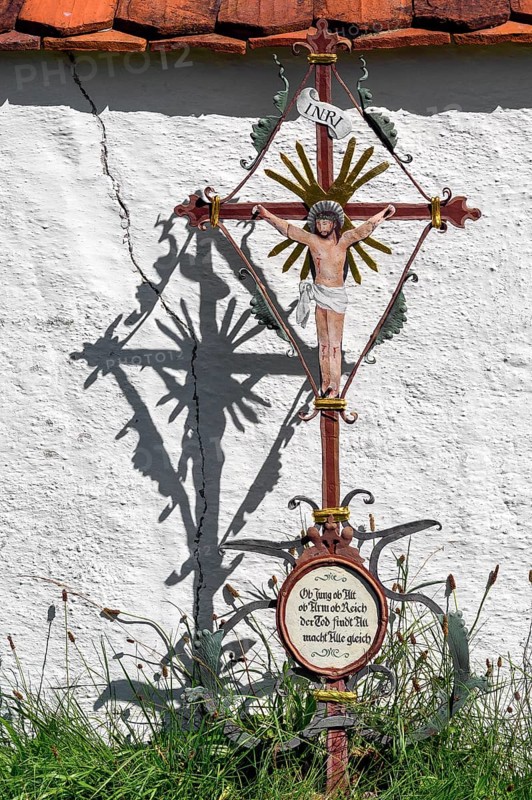 Cemetery wall with iron grave cross in the Swabian Open Air Museum