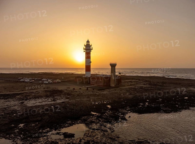Aerial view of the Toston Lighthouse at sunset