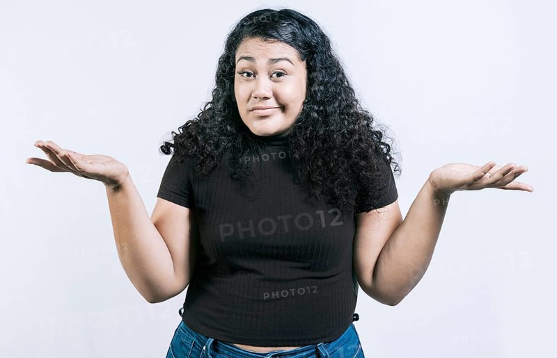 Puzzled woman raising hands isolated. Girl with a puzzled face raising her hands. Puzzled people making hand gestures