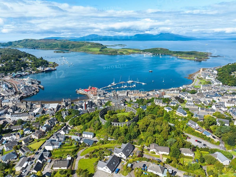 Aerial view of the harbour town of Oban with McCaig's Tower