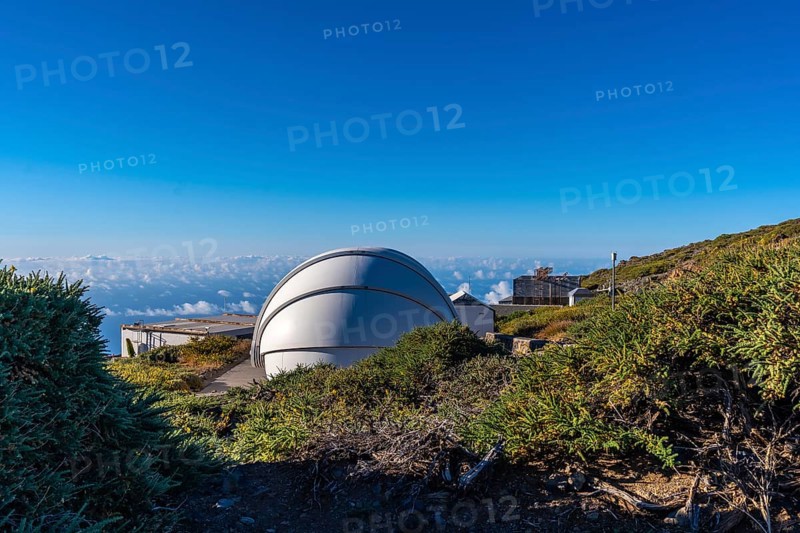 Observatories of the Roque de los Muchachos in the Caldera de Taburiente with a sea of nuts below one summer afternoon