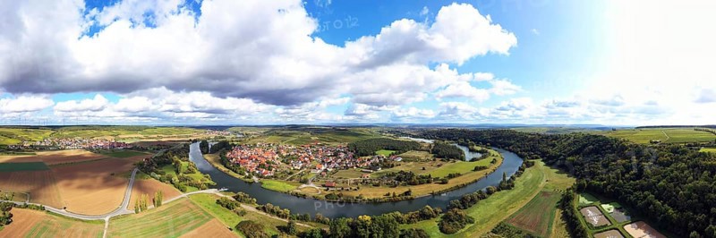 The Mainschleife near Volkach winds through the valley and is surrounded by fields and vineyards. Volkach
